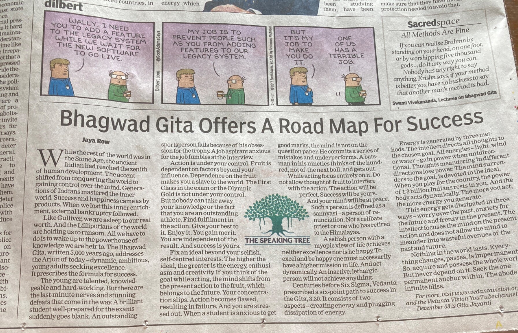 Dilbert cartoon directly above a commentary on the Bhagavad Gita