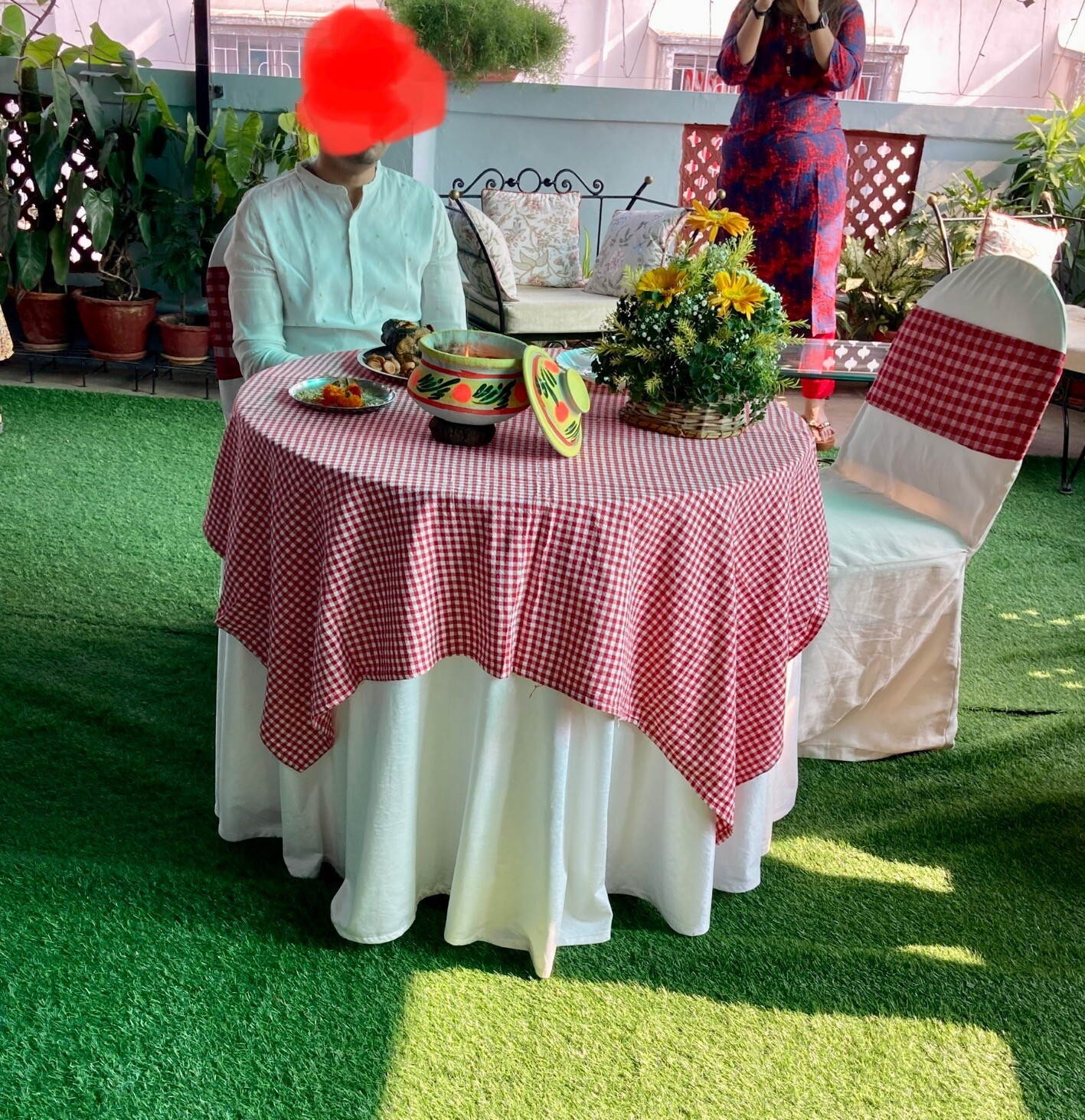 Groom sitting at table.
