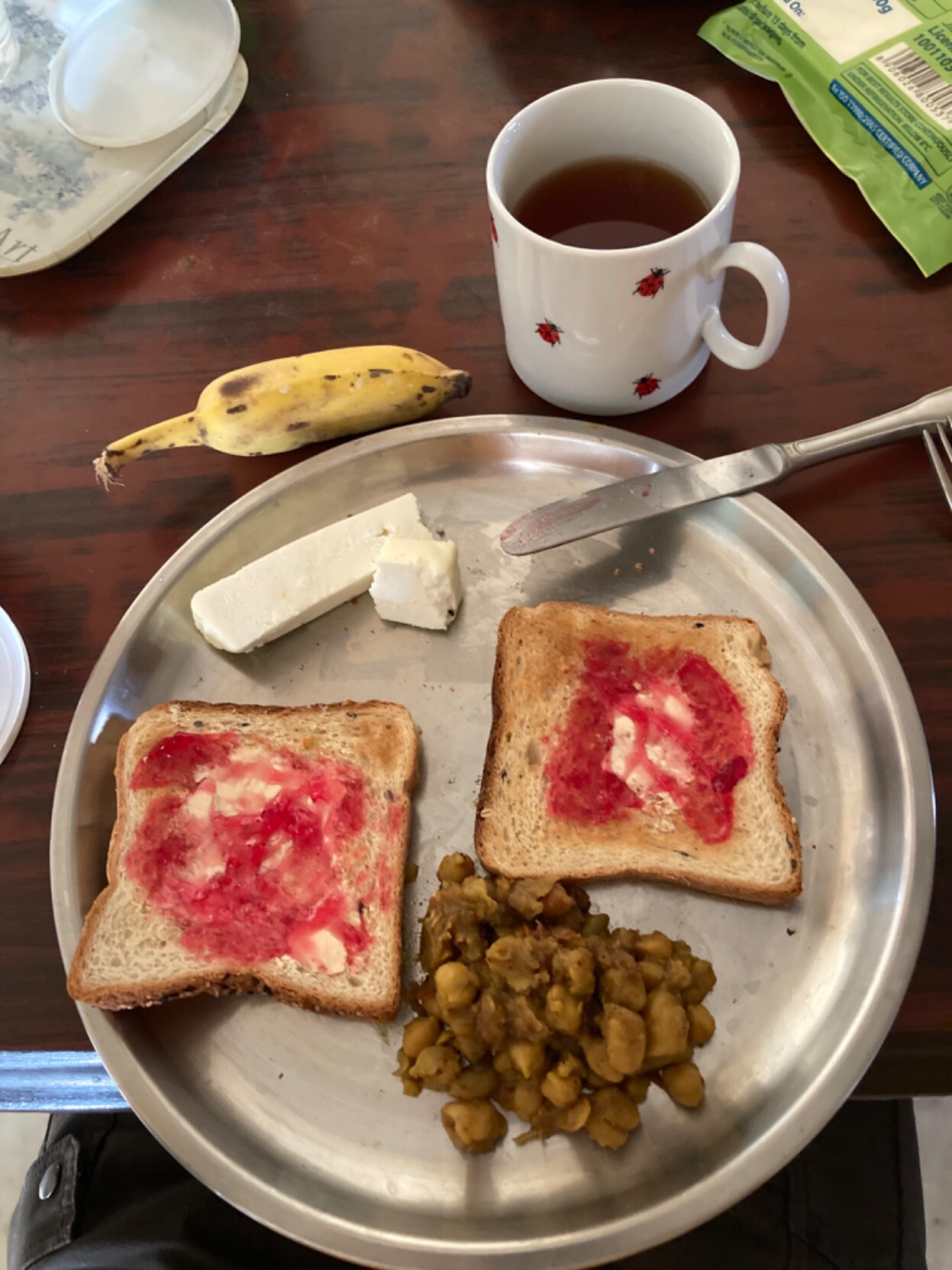 All the items mentioned in the text either on or around a metal plate on a wooden table