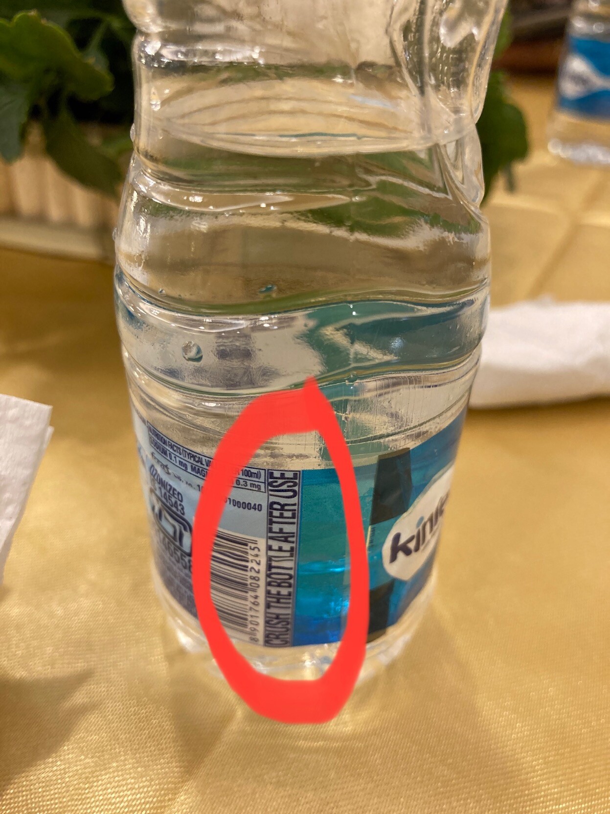 CRUSH THE BOTTLE AFTER USE on the label of a bottle of water