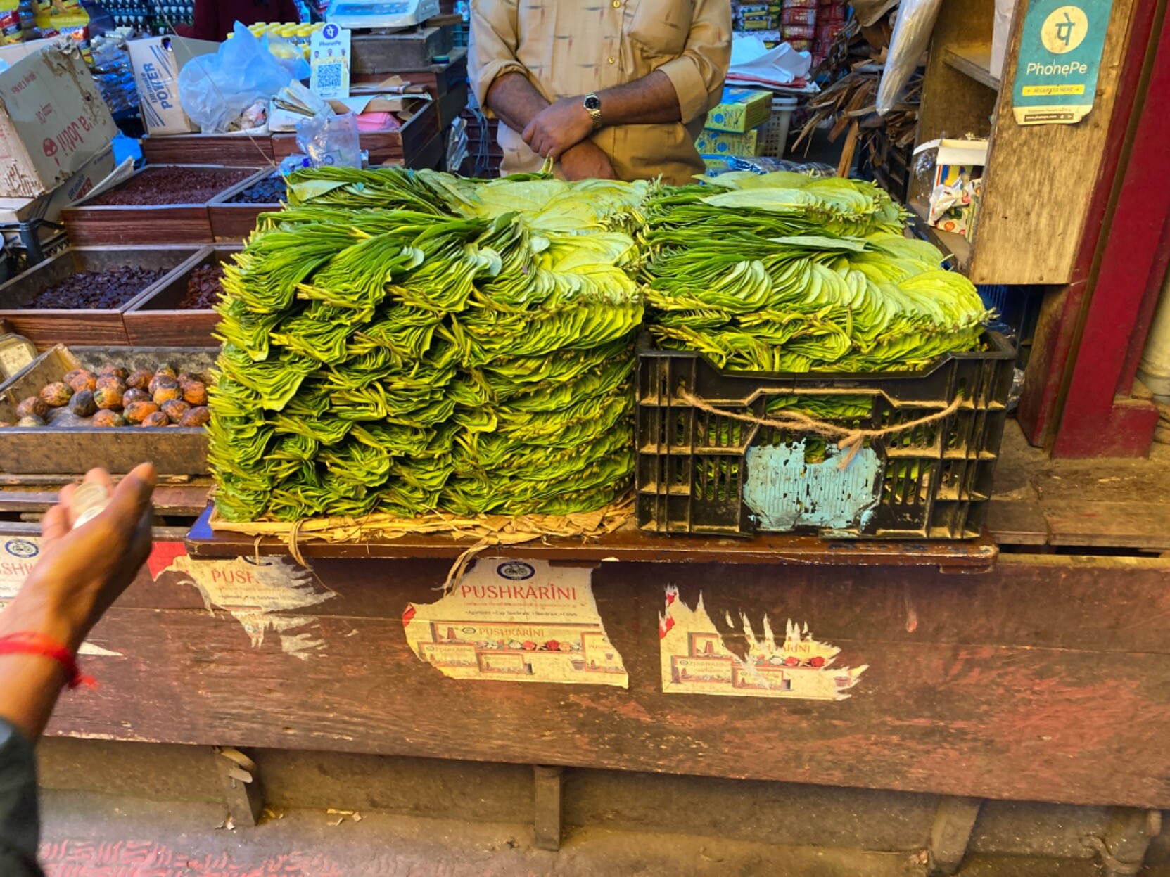 Nuts on left, neatly stacked leaves on right