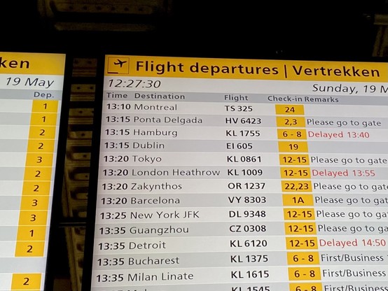 A flight departures board. Listing, among others, the 13:15 flight EI605 to Dublin.
