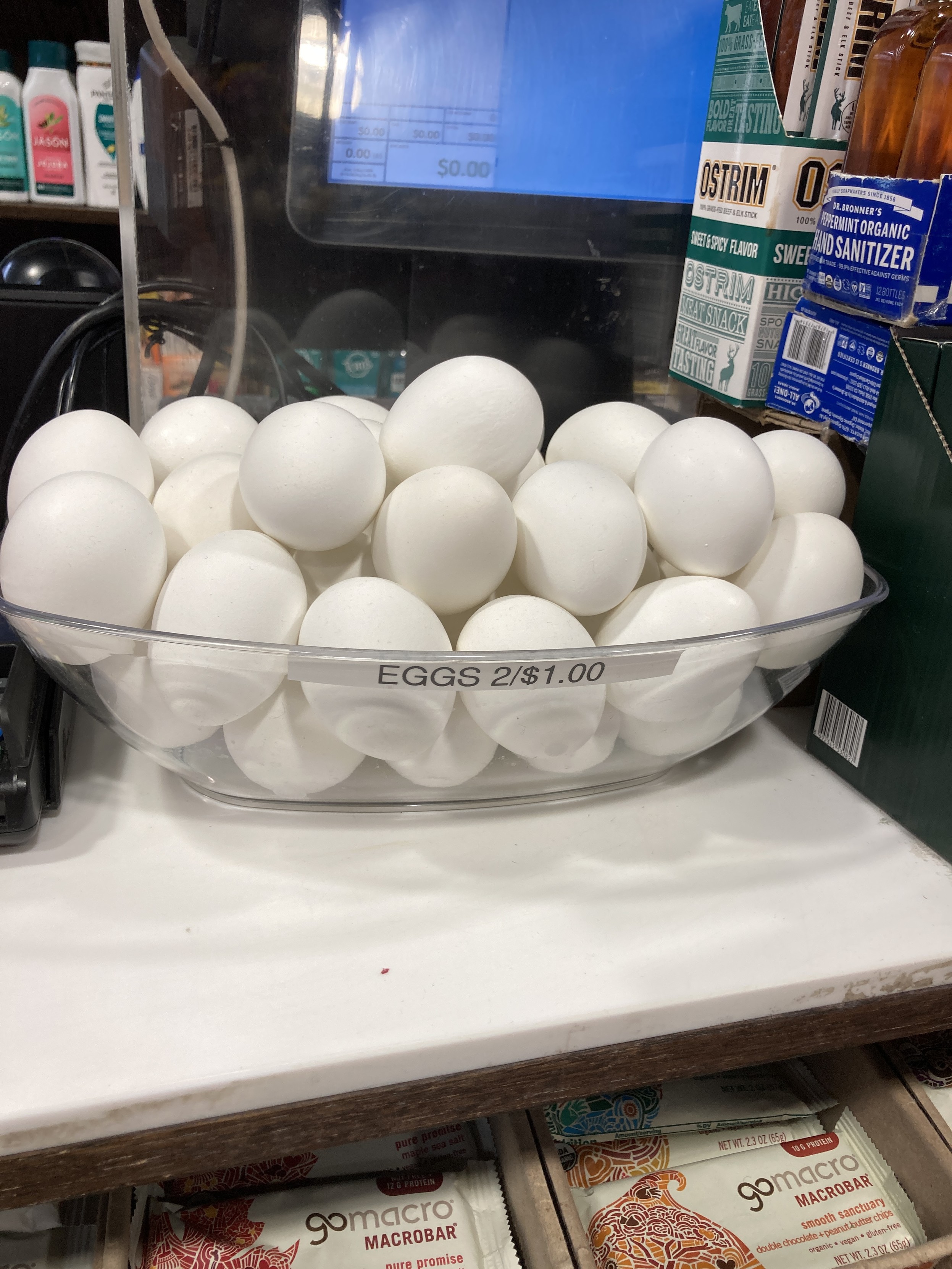 At a checkout counter, a bowl of eggs: 2/$1.00