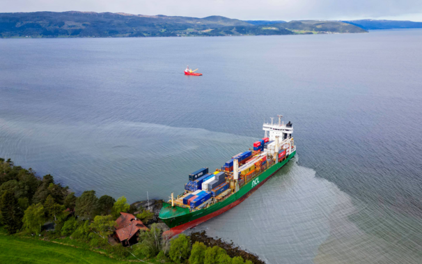 The container ship “NCL Salten” ran ashore in Trondheim Fjord in Norway, directly next to some random resident's house, because the helmsman had fallen asleep.