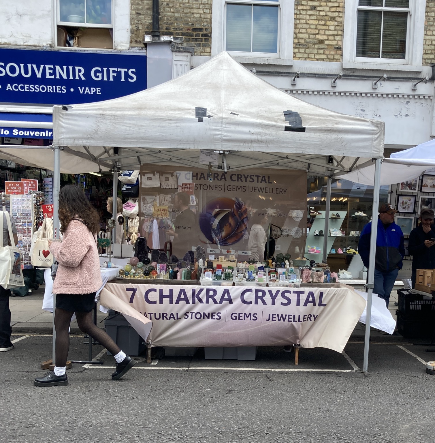 Tented street stall offering chakra crystals
