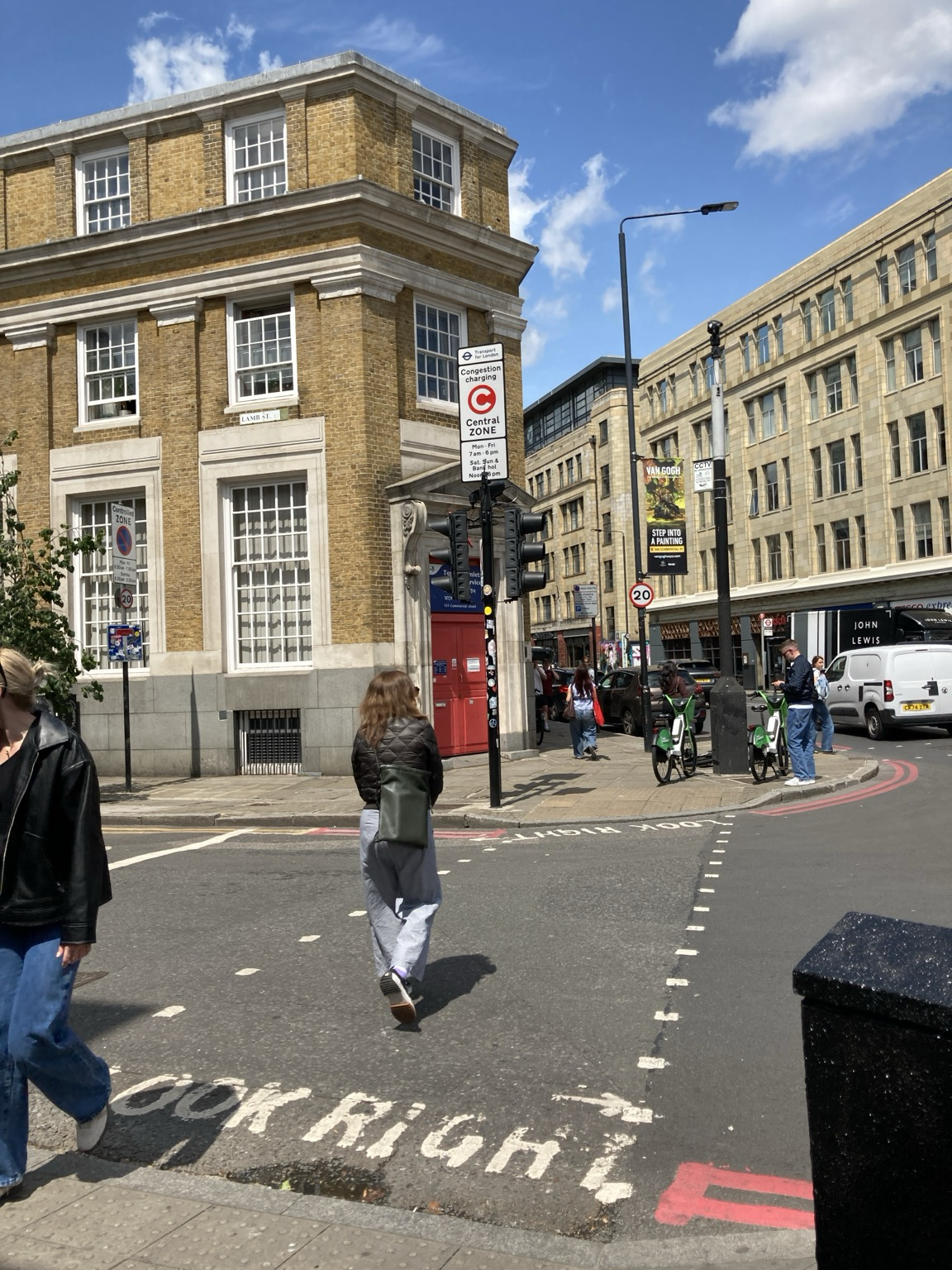Street scene with sign indicating the edge of the congestion zone