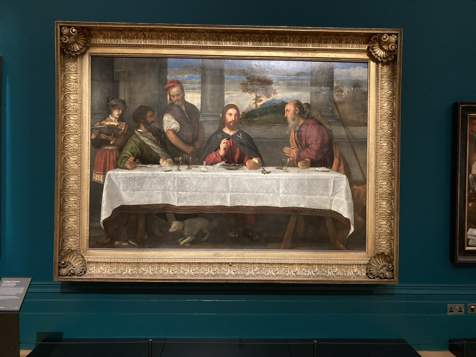 At a table covered with a carpet and then a fine linen tablecloth, the resurrected Jesus breaks bread with his disciples.