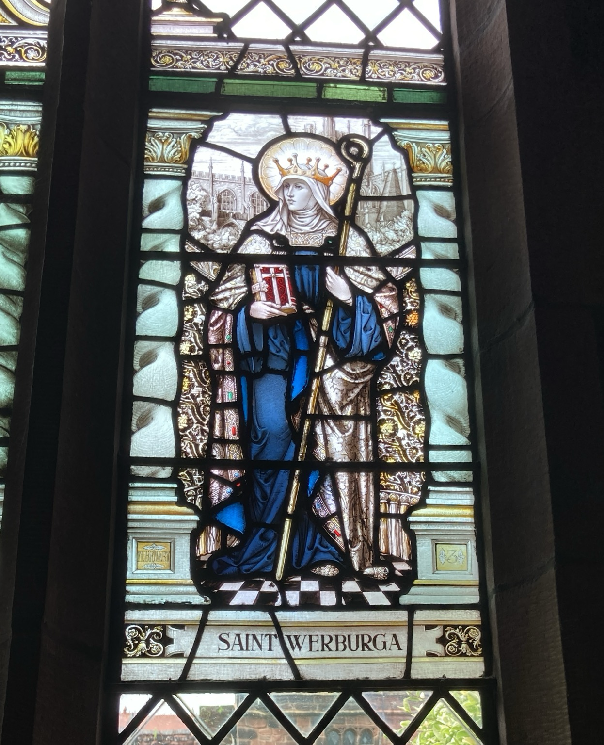 Halied, crowned female saint in medieval garb holding a bishop’s crook?