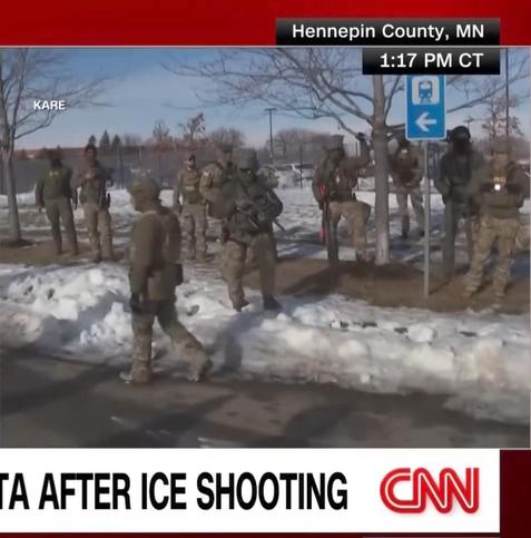 Still from CNN footage showing little green men in Minnesota, i.e. ICE terror troops.
