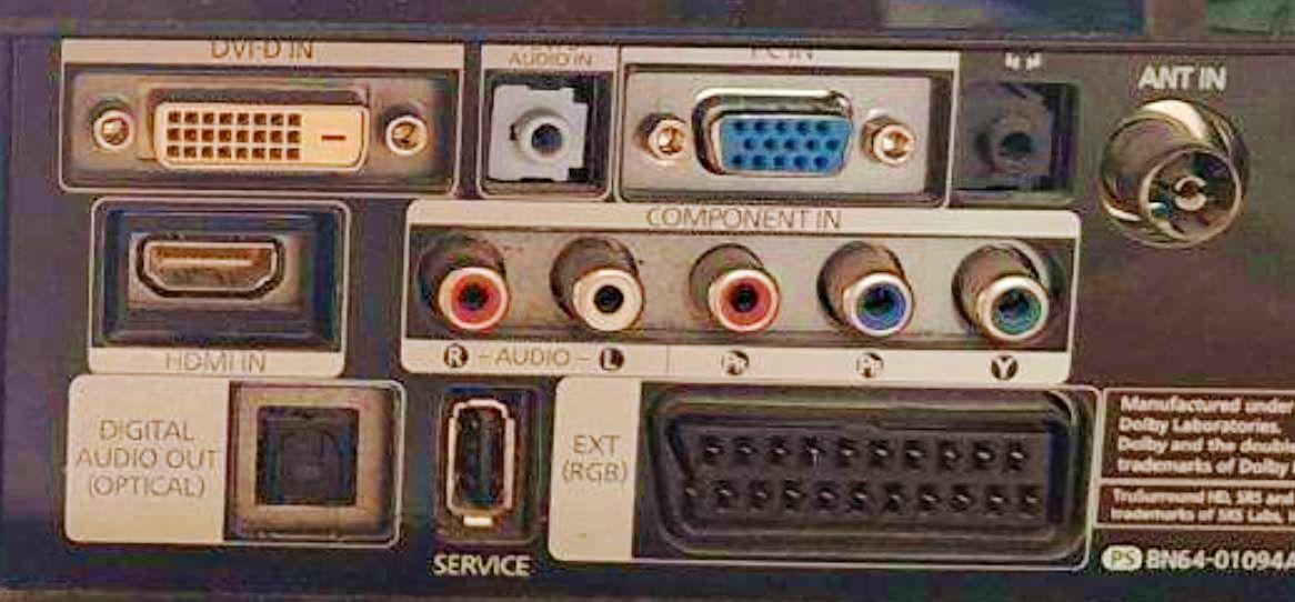 A photo of a TV/monitor connection back panel with the following labeled connectors: DVI-D, 3.5mm audio in, VGA, 3.5mm audio out, coax antenna, HDMI, component A/V, S/PDIF, USB and of course SCART.