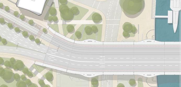 Draufsicht auf den Brückenkopf. Links fächern sich die Fahrspuren auf, rechts ist die eigentliche Brücke über den Fluss. Die Gleise sind sehr gerade, haben jedoch an einer Stelle eine kurze, enge Kurve.