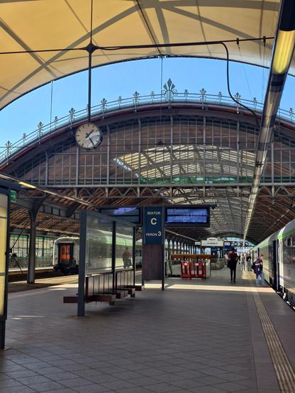 Snapshot from Wroclaw station, where we stopped to say goodbye to the restaurant part of the train that is not allowed to travel to Germany. Old railway station, charming, blue sky.