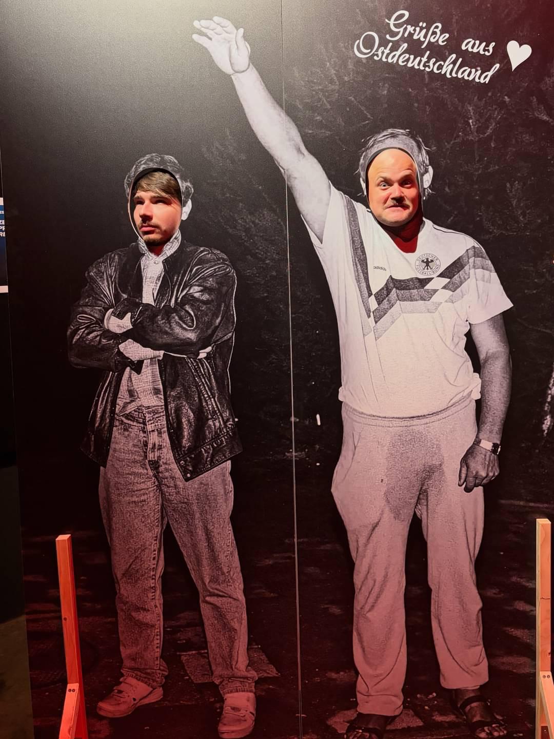 Photo from the party convention of Die PARTEI in Leipzig, 2026.

Photo shows Rostock-Lichenhagen riots of 1992 & "Greetings from East-Germany 🩶".

Further reading:

https://en.wikipedia.org/wiki/Lichtenhagen_riots

https://www.deutschlandfunknova.de/beitrag/harald-ewert-der-haessliche-deutsche